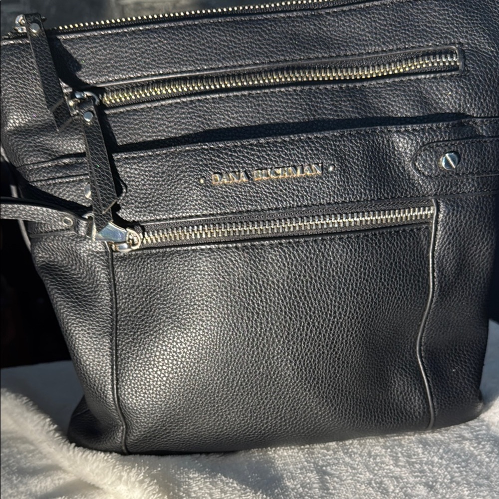Black Crossbody Bag with Silver Zippers and Multiple Compartments